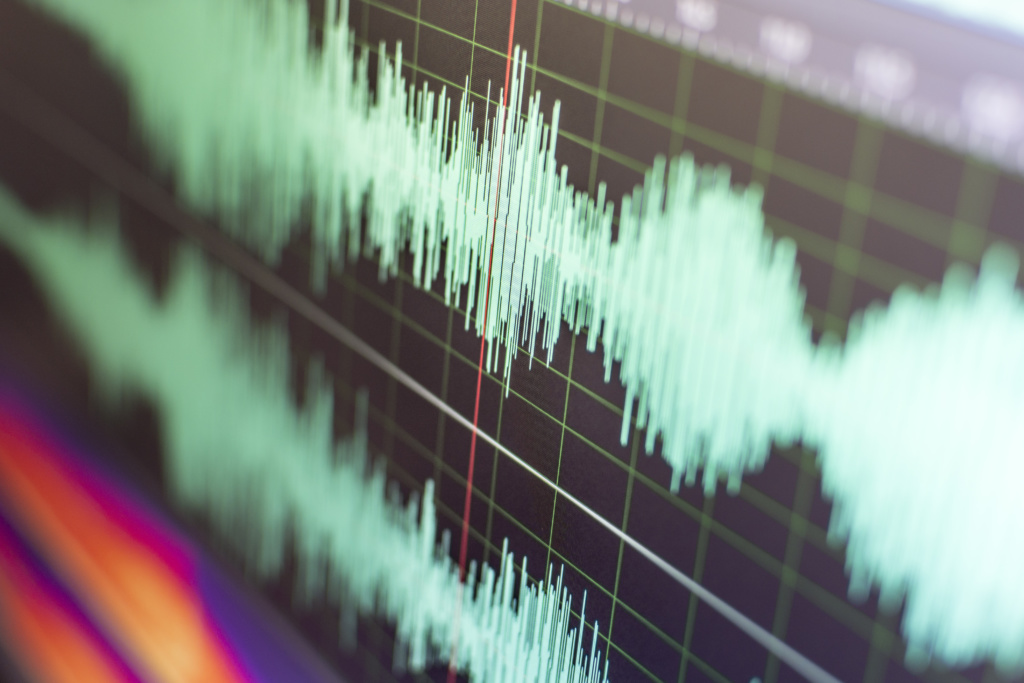 Detail of a computer screen with sound waves in stereo.